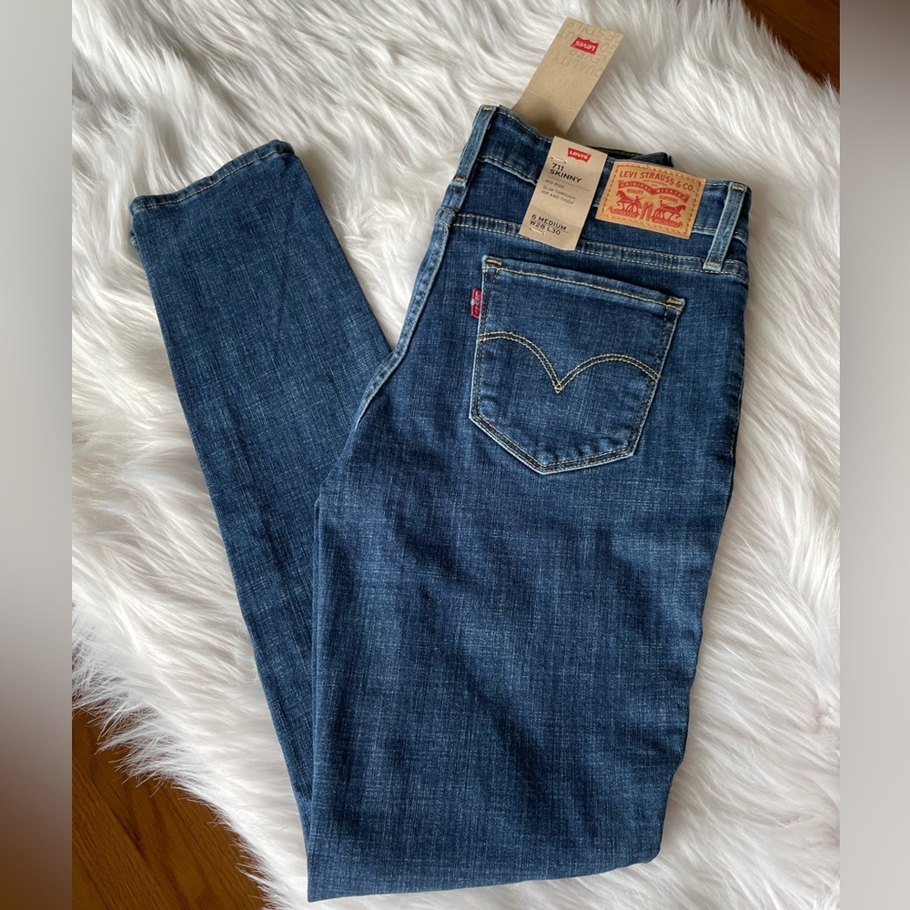 Levi’s 711 skinny jeans mid rise medium wash ripped size 6 w28 l30